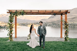 married couple in front of lake