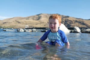 little boy playing in the water lake chelan