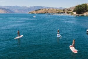 paddle boarders on a Lake Chelan vacation